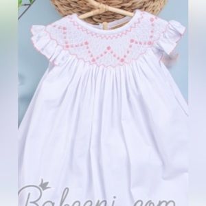 Babeeni new with tags. White with light pink smocked bishop dress